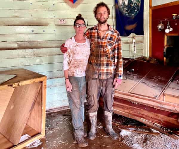 Eddie Lloyd and Adam Guise in the flood-damaged kitchen.