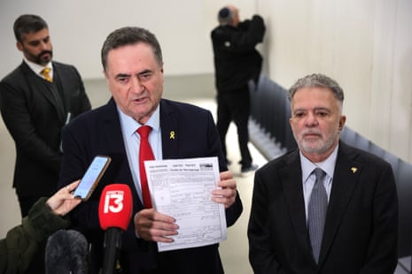 Brazilian ambassador to Israel Frederico Meyer (R) looks on as Israeli foreign minister Israel Katz (L) delivers a statement declaring the Brazilian president “persona non grata” at the Yad Vashem Holocaust Memorial Museum in Jerusalem.
