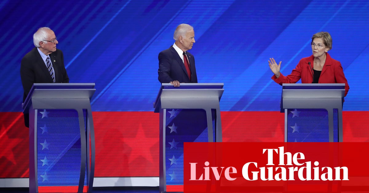 Democratic debate: Warren and Sanders clash with Biden over healthcare – live