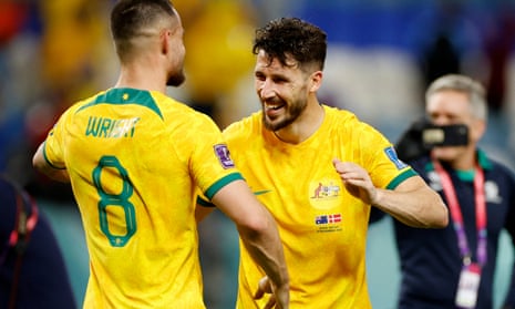 Australia’s Mathew Leckie celebrates with Bailey Wright after qualifying for the knockout stages.
