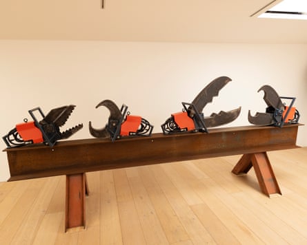 Cutting tools perched on a girder in a room