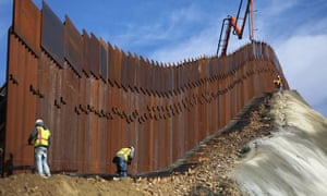 A construction crew works on new sections of the US-Mexico border barrier. 6720.jpg?width=300&quality=85&auto=forma