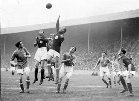Cardiff goalkeeper Tom Farquharson leaps to clear an Arsenal attack under pressure from Charlie Buchan in the 1927 FA Cup Final.