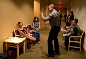 Obama shows off his dance moves as he and Michelle wait backstage during his daughter Sasha's dance recital.