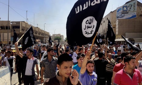 Isis supporters march in Mosul in 2014 as the city fell to the terror group.