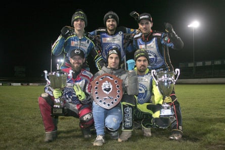 Workington Comets riders after their final meeting of the 2018 season with the League Championship, KO Cup and Championship Shield trophies.