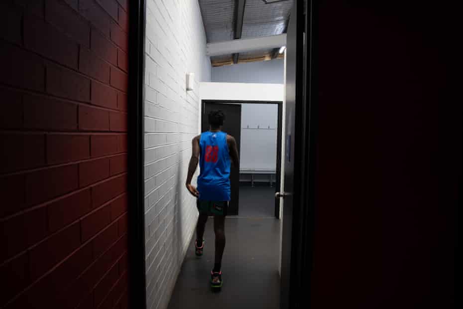 One of the boys walking into to the locker room at the PCYC.
