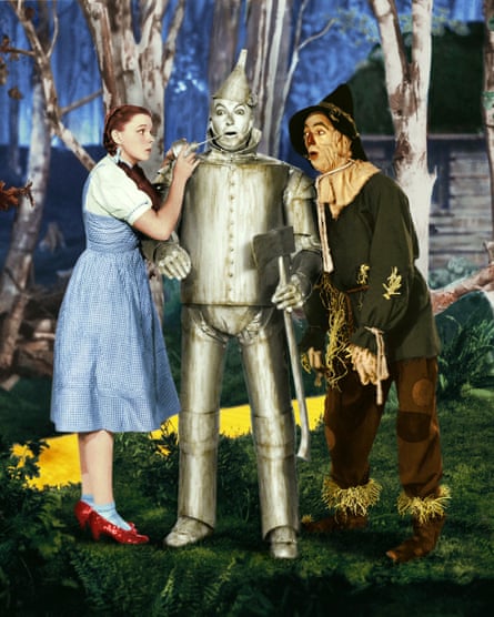 Judy Garland in her ruby slippers as Dorothy in the Wizard of Oz (1939) with Ray Bolger and Jack Haley (right).