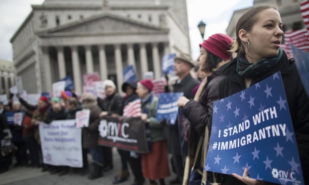 Demonstrators take part in a rally in support of Muslims and immigrants Friday in New York City.