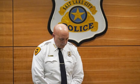 Mike Brown, the Salt Lake City police chief, listens as Mayor Erin Mendenhall speaks during a news conference on Monday following the shooting.