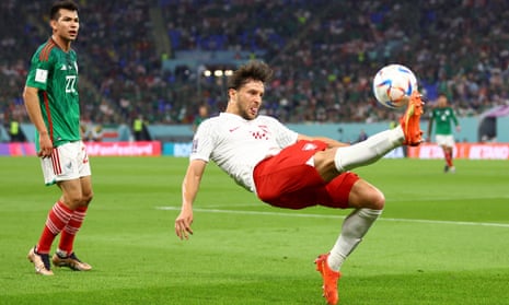 Poland's Bartosz Bereszynski with some acrobatics as Lozano looks on.