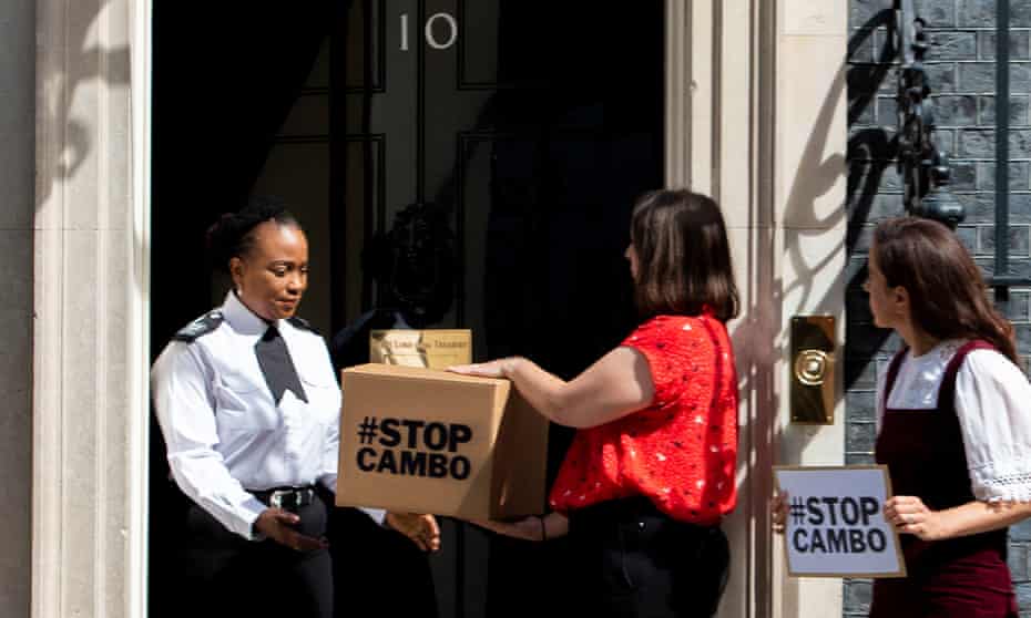 Friends of the Earth Scotland campaigners deliver a petition to Downing Street on 5 August, opposing the Cambo oil field.
