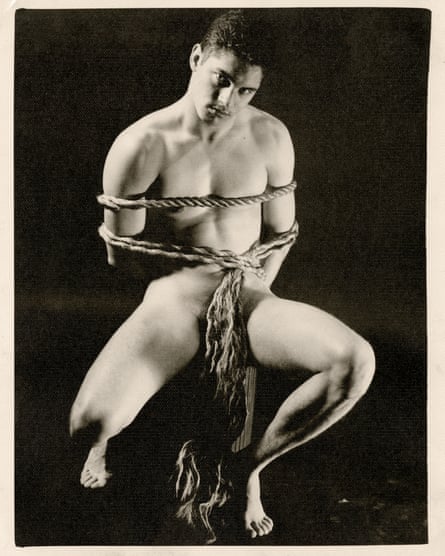 Nude man tied to a chair