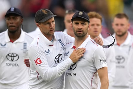 Joe Root and Mark Wood look dejected aft England illness connected time 2 of nan Ashes opener against Australia successful Perth