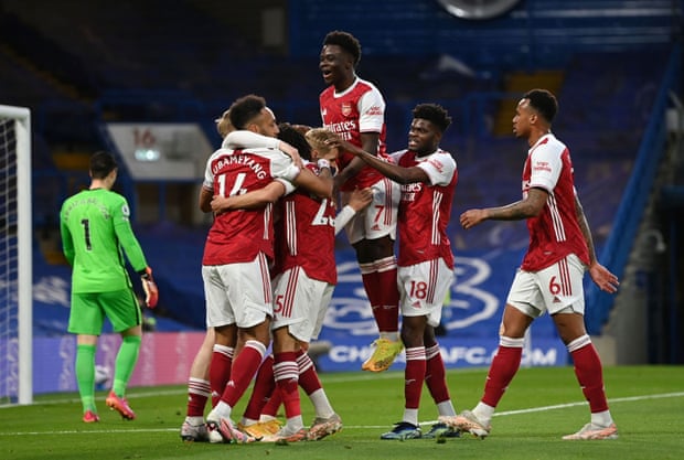 Arsenal’s Emile Smith-Rowe is mobbed by his teammates after opening the scoring.