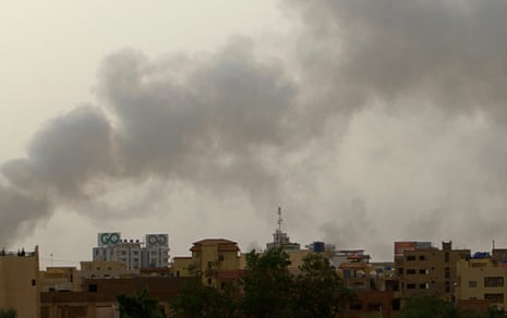 Smoke billows over buildings in southern Khartoum on Monday, amid ongoing fighting between the forces of two rival generals.  