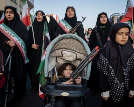Women and children at a military parade in Tehran, Iran, on Friday