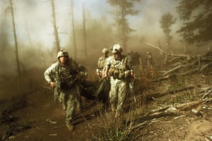 US troops carry the body of Staff Sergeant Larry Rougle, killed by Taliban insurgents in an ambush in the Korengal Valley, Afghanistan in October 2007