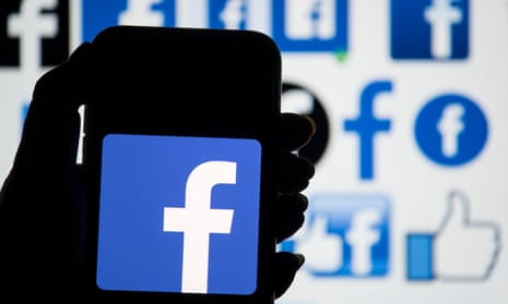 The Facebook logo displayed on a smartphone