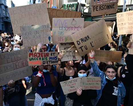 Protestors hold placards during a protest against education reforms by the Wallonia-Brussels Federation government and an increase in student fees in Liège, Belgium.