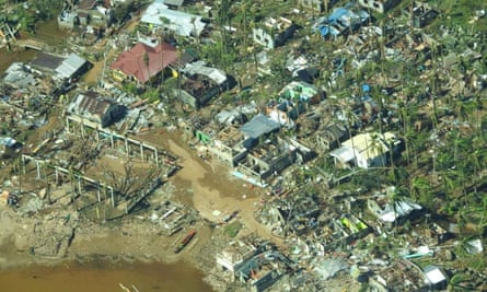 Aerial view showing damaged houses in Surigao City, Surigao Del Norte province