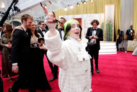 Billie Eilish arrives wearing an oversized Chanel trousersuit at the 92nd Academy Awards in Hollywood.