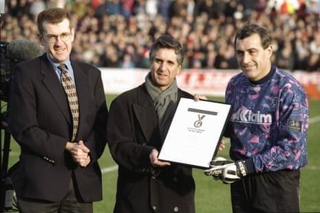 Peter Shilton, Leyton Orient goalkeeper (right), playing his 1000th league game against Brighton, presented with a commemerative edition of the Guinness Book of Records.