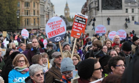 Hundreds of campaigners rally against funding cuts to libraries, museums and galleries outside The National Gallery in London