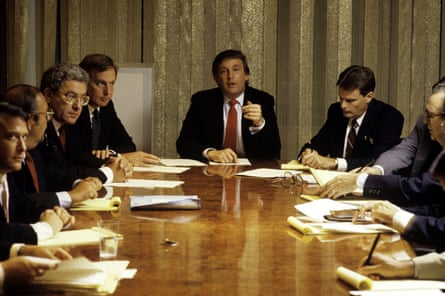 men at a office table in pictures from the 80s