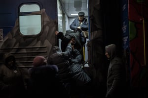 Ukrainians board the Kherson-Kyiv train at the railway station in Kherson