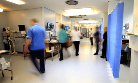 Blurred image of staff on a NHS hospital ward,