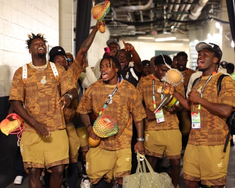 The Ghana squad sing and dance on the way to the changing rooms.