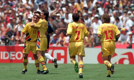 Ilie Dumitrescu celebrates with his Romania team-mates after finding the net against Argentina at USA 94