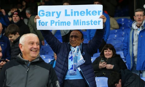 A Manchester City fan holding a sign stating “Gary Lineker for Primer Minister” at Selhurst Park in London.