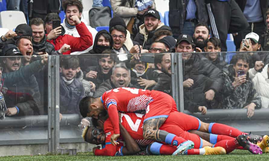 Victor Osimhen is mobbed after sealing victory for Napoli.