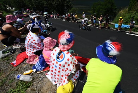 Matteo Vercher of TotalEnergies competes while fans cheer during stage 13.