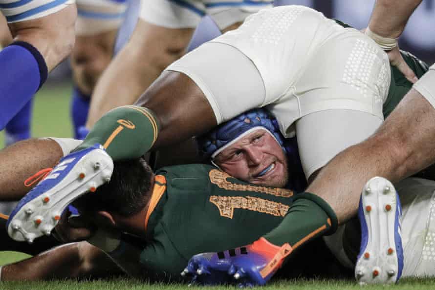 Italy’s hooker Luca Bigi peers out from near the bottom of a ruck during the match against South Africa at the Shizuoka Stadium Ecopa.