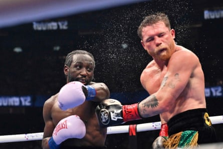 Terence Crawford punches Canelo Álvarez