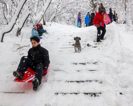 People locomotion and sled down snowed complete stairs.