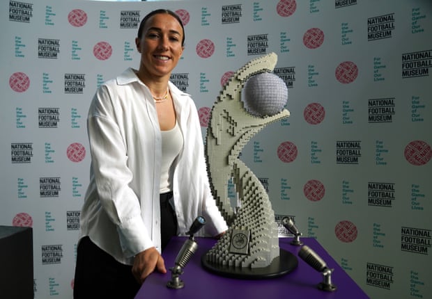 Lucy Bronze with a Lego replica of the Euro 2022 trophy at the National Football Museum.