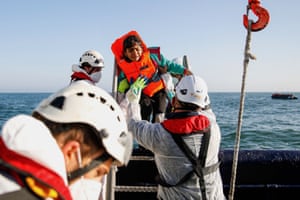 A girl cries as people are rescued by crew members of the Abeille Languedoc ship after their boat’s generator broke down off Boulogne-sur-Mer, France, while they were trying to cross the Channel to Britain
