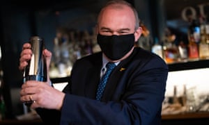 The Lib Dem leader Sir Ed Davey making a cocktail during a visit to Bar Bodega in Watford today.