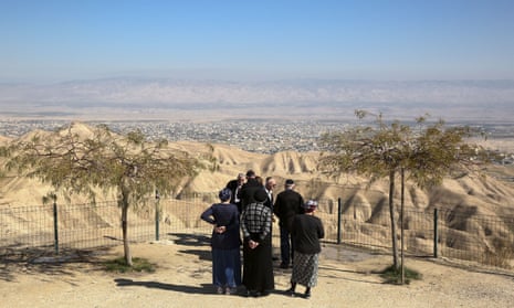Jewish settlers at a viewpoint in the Judean desert overlooking the West Bank city of Jericho. 