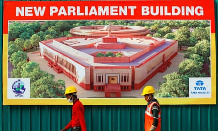 A hoarding on the construction site displays an image of the complex in Delhi.