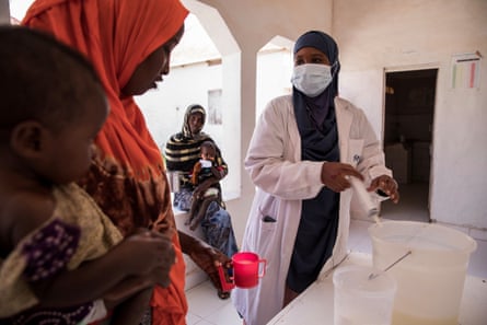 A woman and child speak to a doctor at the South Galkayo hospital. Names withheld on request.
