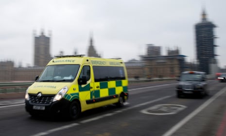 An ambulance crosses Westminster Bridge on December 28 in London.