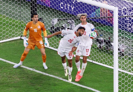Tunisia’s Anis Slimane and Ellyes Skhiri in action as Japan’s Ayase Ueda scores Japan’s fourth goal.