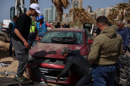 Men around a broken car