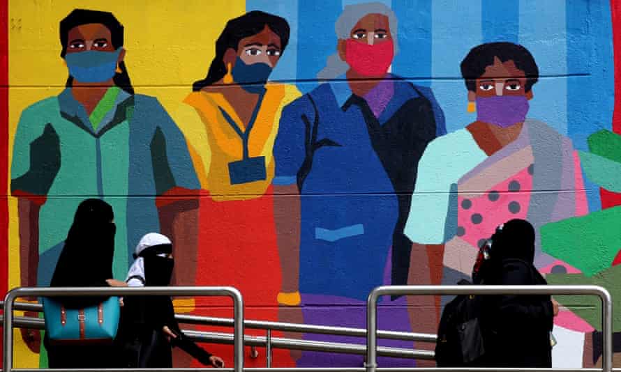 Public art by Aravani shows people wearing face masks to increase public awareness of coronavirus