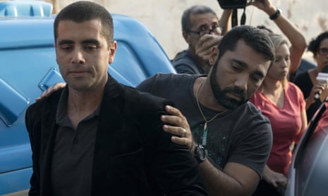 Denis Furtado is escorted by police after his arrest in Rio de Janeiro in July